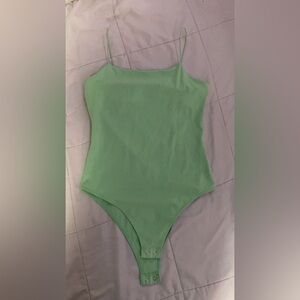 Light green simple bodysuit, good condition, barley worn, brighter color, medium